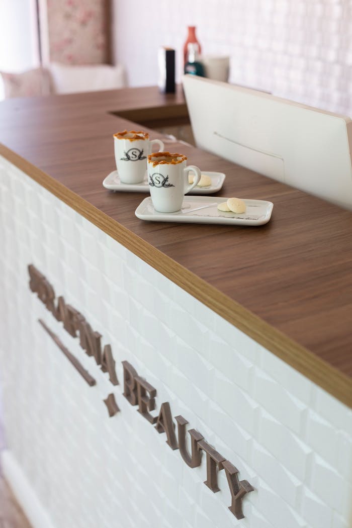 Beautifully presented coffee cups on a modern wooden counter with a stylish interior design.